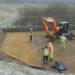 Stone above liner drainage lagoon at Costessey, Norwich